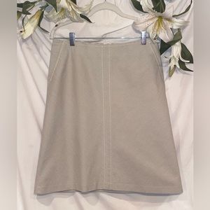 Banana Republic. Size 4. Above the knee cream and gray striped skirt.